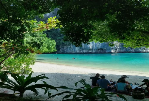 Small group swimming in a hidden lagoon beach at Koh Hong Krabi, Thailand.