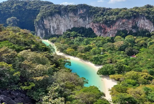 Aerial view of Hong Lagoon with turquoise water, white sandy beach, and limestone cliffs in Krabi.