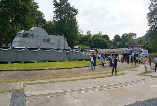 Tourists visiting Police Boat 813 memorial in Khao Lak on Khao Sok Discovery tour.