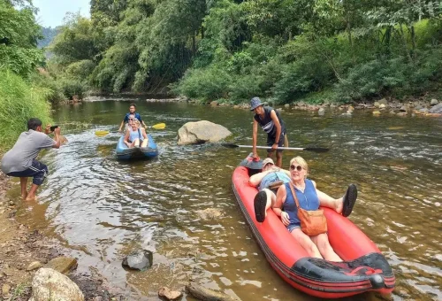 Tourists on canoes enjoying a river break in Khao Sok National Park.