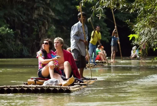 Tourists enjoying a bamboo rafting experience on the Sok River with Phuket Travel Store.