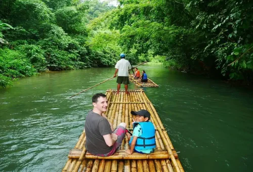 Family enjoying bamboo rafting on the Sok River with Phuket Travel Store.