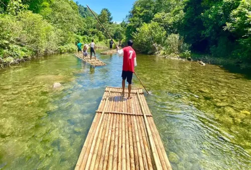 Tourists rafting on a crystal-clear river in Khao Sok National Park.