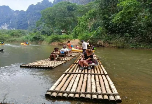 Bamboo rafting in Khao Sok with limestone mountains in background