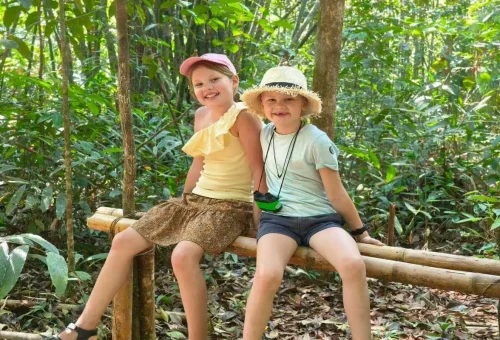Two children smiling during a jungle hike in Khao Sok