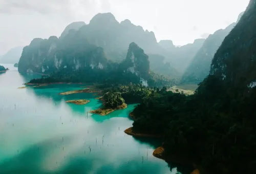 Aerial view of Cheow Lan Lake with limestone mountains and rainforest.