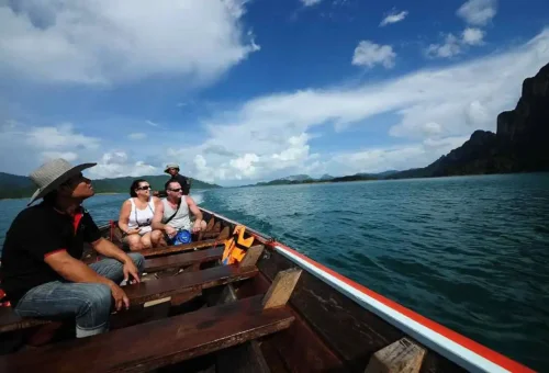 Longtail boat ride on emerald Cheow Lan Lake, a must-do experience.