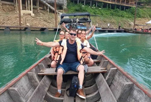 Tourists enjoying a longtail boat ride at Cheow Lan Lake in Khao Sok National Park.