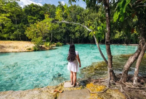 Traveler enjoying the Emerald Pool Krabi with crystal waters.