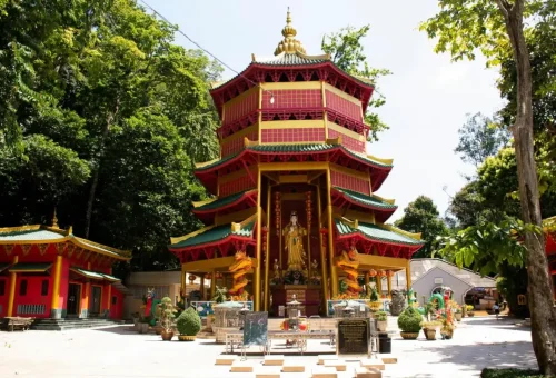 Chinese-style pagoda at Tiger Cave Temple Krabi surrounded by jungle.
