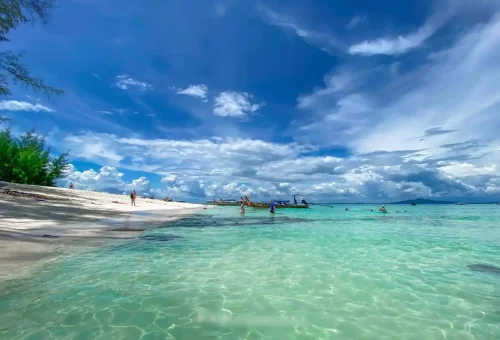 Shallow turquoise water and white sand beach at Bamboo Island.