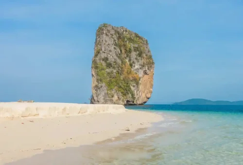 Limestone cliff of Poda Island rising from the Andaman Sea in Krabi.
