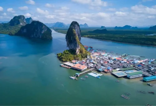 Aerial view of Koh Panyee floating village and limestone mountain in Phang Nga Bay