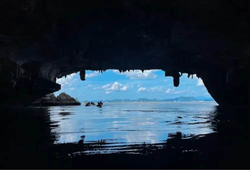 Sea canoe entering hidden lagoon cave in Phang Nga Bay
