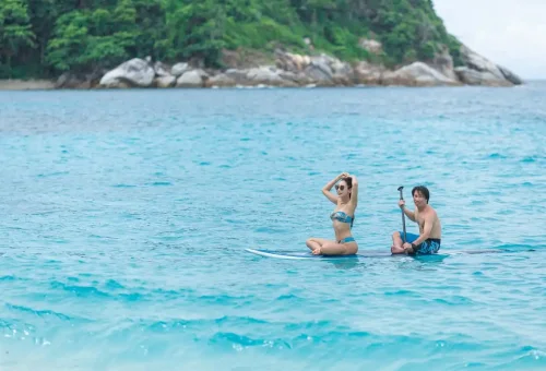 Couple paddle boarding near Maiton Island Phuket