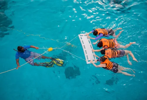 Tour guide leading snorkeling group at Raya Island Phuket