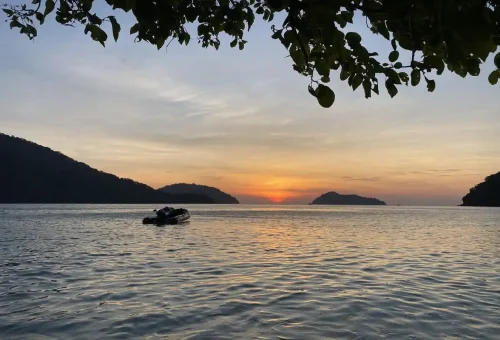 Speedboat anchored at Surin Islands coral reef Thailand