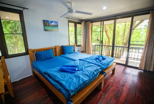 Comfortable twin bed bungalow room with balcony at Surin Islands Thailand