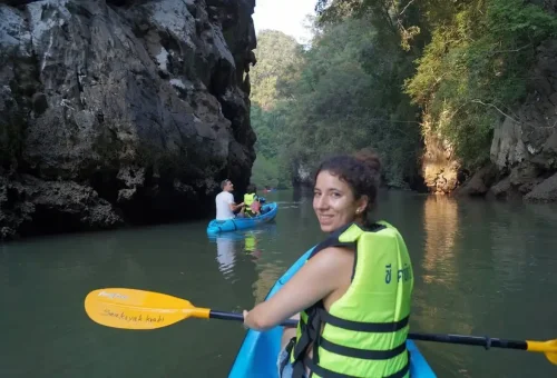 Woman kayaking with limestone canyon view in Ao Thalane Krabi