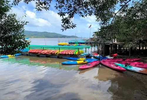 Colorful kayaks lined up on the pier at Ao Thalane Krabi Thailand