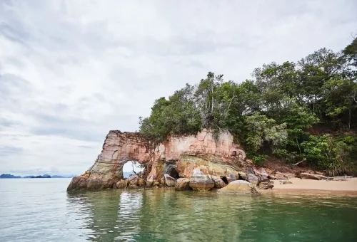 Natural limestone arch formation along the coast of Koh Hong Island in Krabi, Thailand.