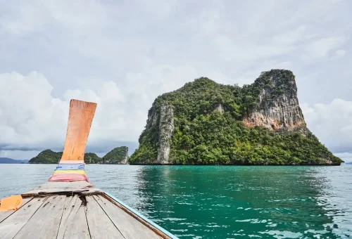 View from a longtail boat approaching the limestone islands of Koh Hong Archipelago in Krabi.