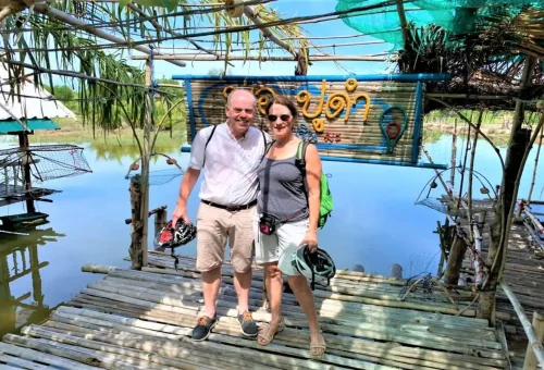 Visitors at local fishing village bamboo hut in Krabi