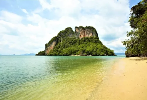 Canoeing beneath limestone caves in Phang Nga Bay, a highlight of the James Bond Discovery tour.