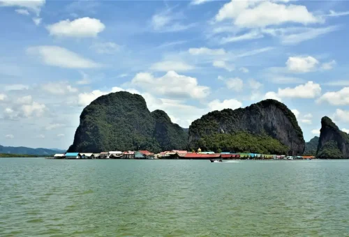 Floating Muslim village of Koh Panyee surrounded by limestone mountains in Phang Nga Bay.