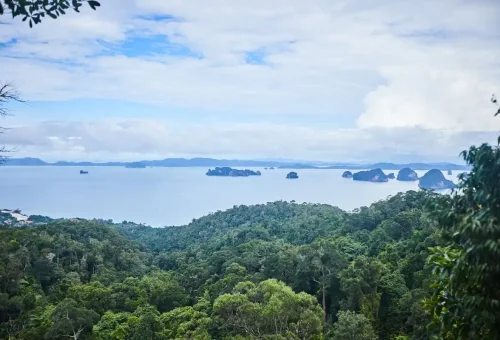 Panoramic view of Andaman Sea and limestone islands from Dragon Crest Mountain viewpoint.