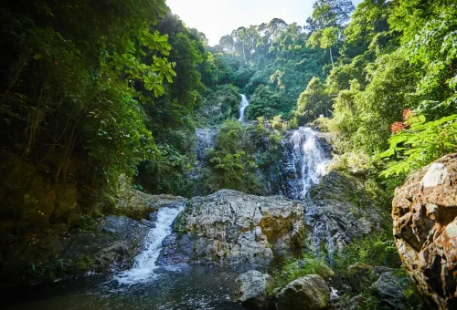 Crystal-clear water pool at the base of Huay Tho Waterfall in Krabi.