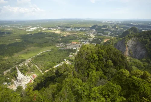 Aerial view of Tiger Cave Temple and lush valley landscape in Krabi.