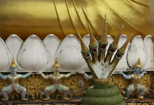 Golden and colorful Naga serpent sculpture at Tiger Cave Temple, Krabi.