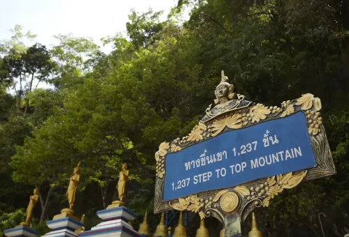 Sign showing “1,237 Steps to Top Mountain” at the base of Tiger Cave Temple.