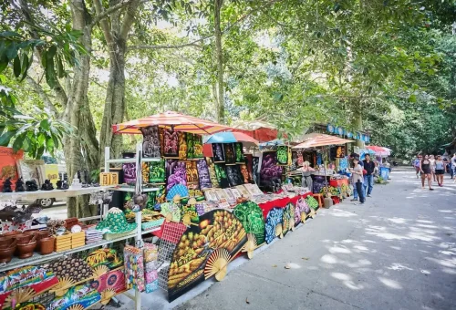Colorful local market stalls selling handmade souvenirs and crafts in Koh Samui.