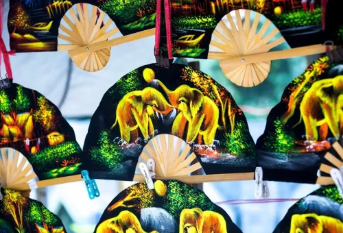 Hand-painted elephant fans at a local souvenir market in Koh Samui.