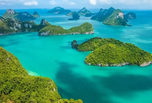 Aerial view of Koh Ang Thong National Marine Park with emerald lagoons, limestone cliffs, and tropical islands in the Gulf of Thailand.