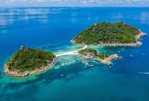 Twin islands of Koh Nangyuan connected by white sandbar surrounded by turquoise sea near Koh Tao.