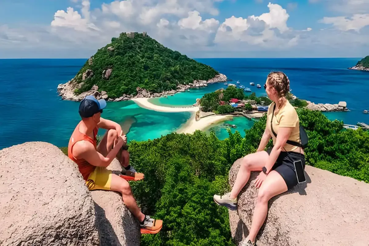 Tourists admiring the panoramic view of Koh Nangyuan’s twin islands and connecting sandbar.