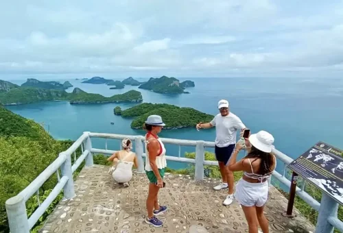 Tourists enjoying the viewpoint over Angthong Marine Park with stunning sea and islands.