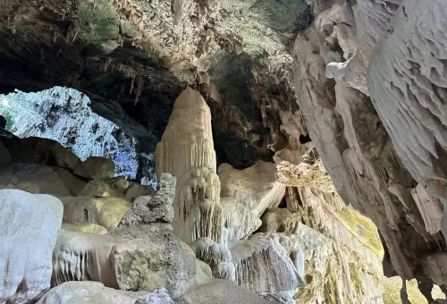 Inside the limestone cave of Koh Wua Talap with stunning stalactites and rock formations.