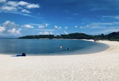 Tranquil lagoon and white sandy beach at Coral Island, part of the Samui Coral & Pig Island Tour.