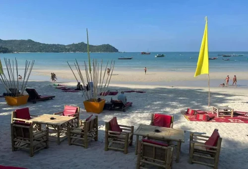 Bamboo chairs and beachfront restaurant on Koh Phangan