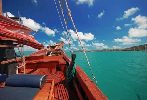 Cozy interior and deck view from Koh Phangan cruise boat