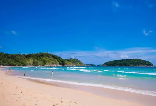 Private Phuket City Tour – Nai Harn Beach with turquoise waves and soft sand, a scenic stop with Phuket Travel Store.