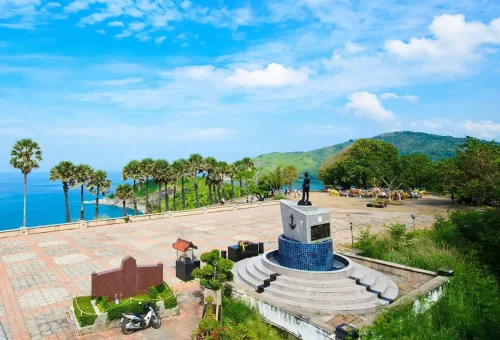 Private Phuket City Tour – Promthep Cape viewpoint with palm trees, ocean views, and local monument with Phuket Travel Store.