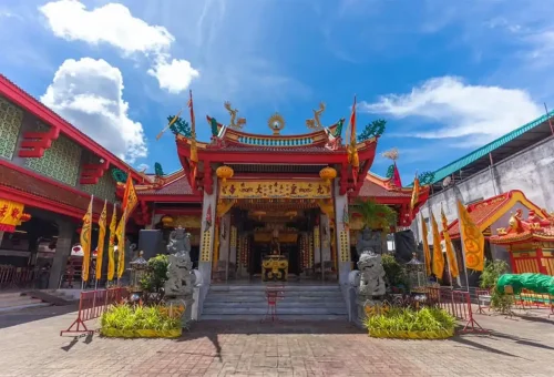 Vibrant entrance of Jui Tui Chinese Shrine in Phuket Old Town during a sunny day.