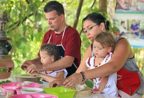 Family-friendly Thai cooking class in Krabi where parents and children learn to prepare authentic dishes.