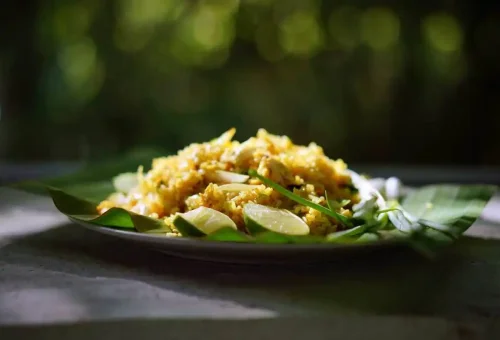 Freshly cooked Thai fried rice served on banana leaf during a cooking class in Krabi.