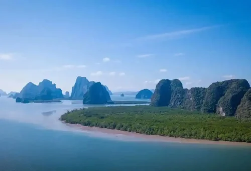 Panoramic view of Phang Nga Bay’s limestone mountains, mangroves, and sea from a James Bond private speedboat excursion.
